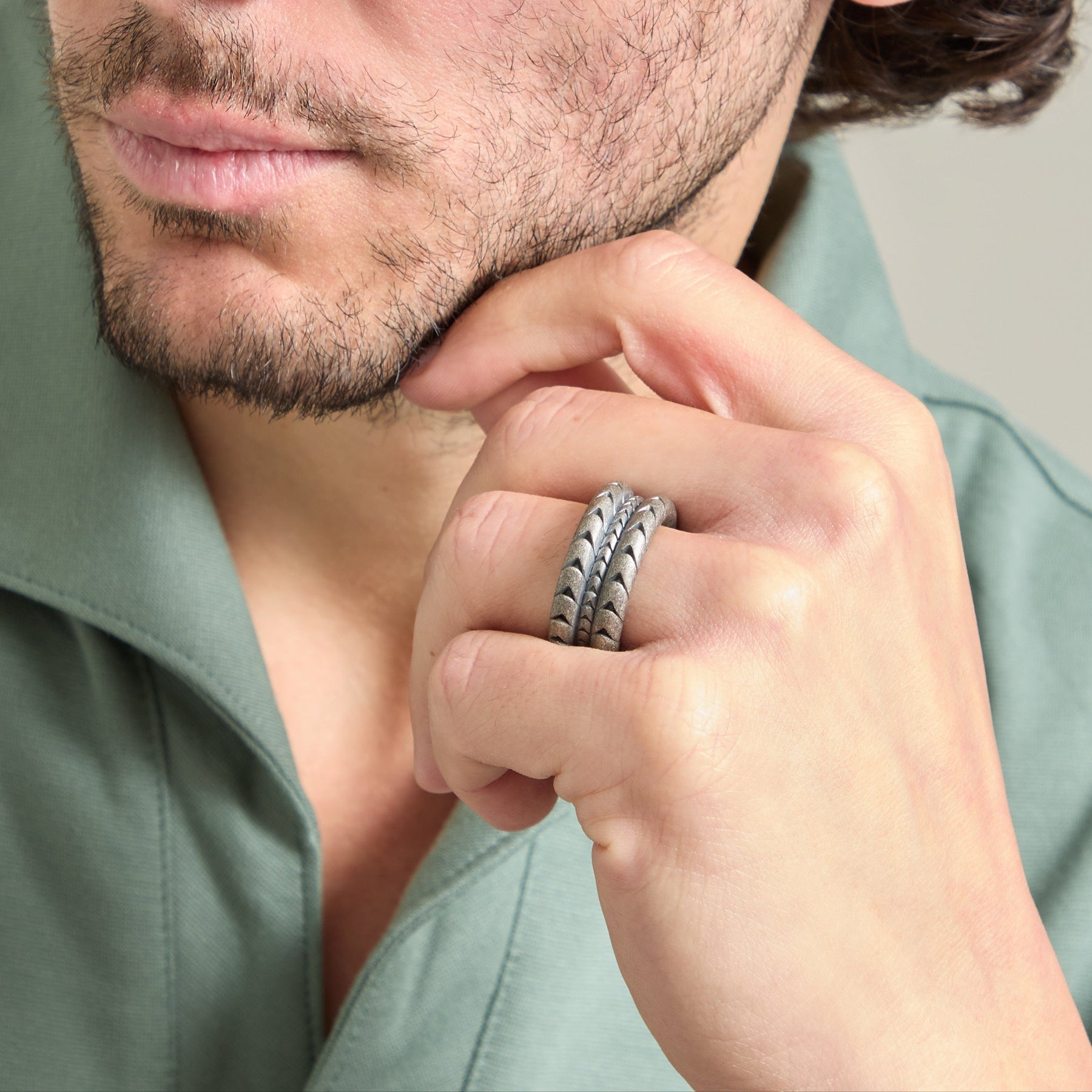 Model wearing the Iron Snake oxidized silver ring on ring finger.