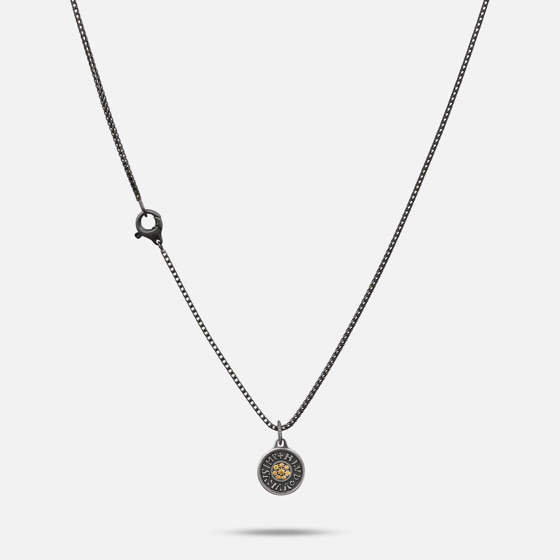 Necklace with a round pendant on a white background