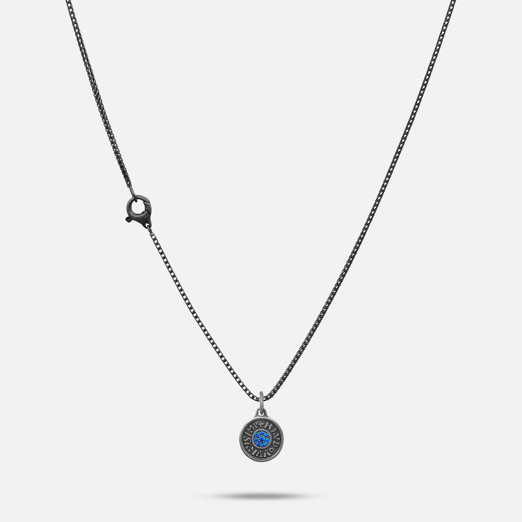 Necklace with a round pendant on a white background