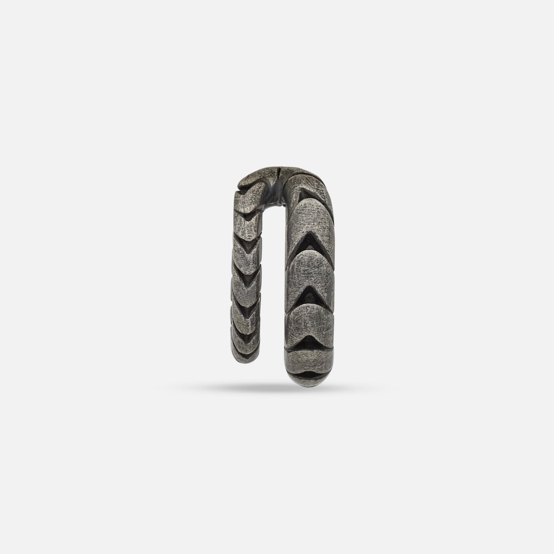 Front view of Iron Snake ear cuff in oxidized silver on display.