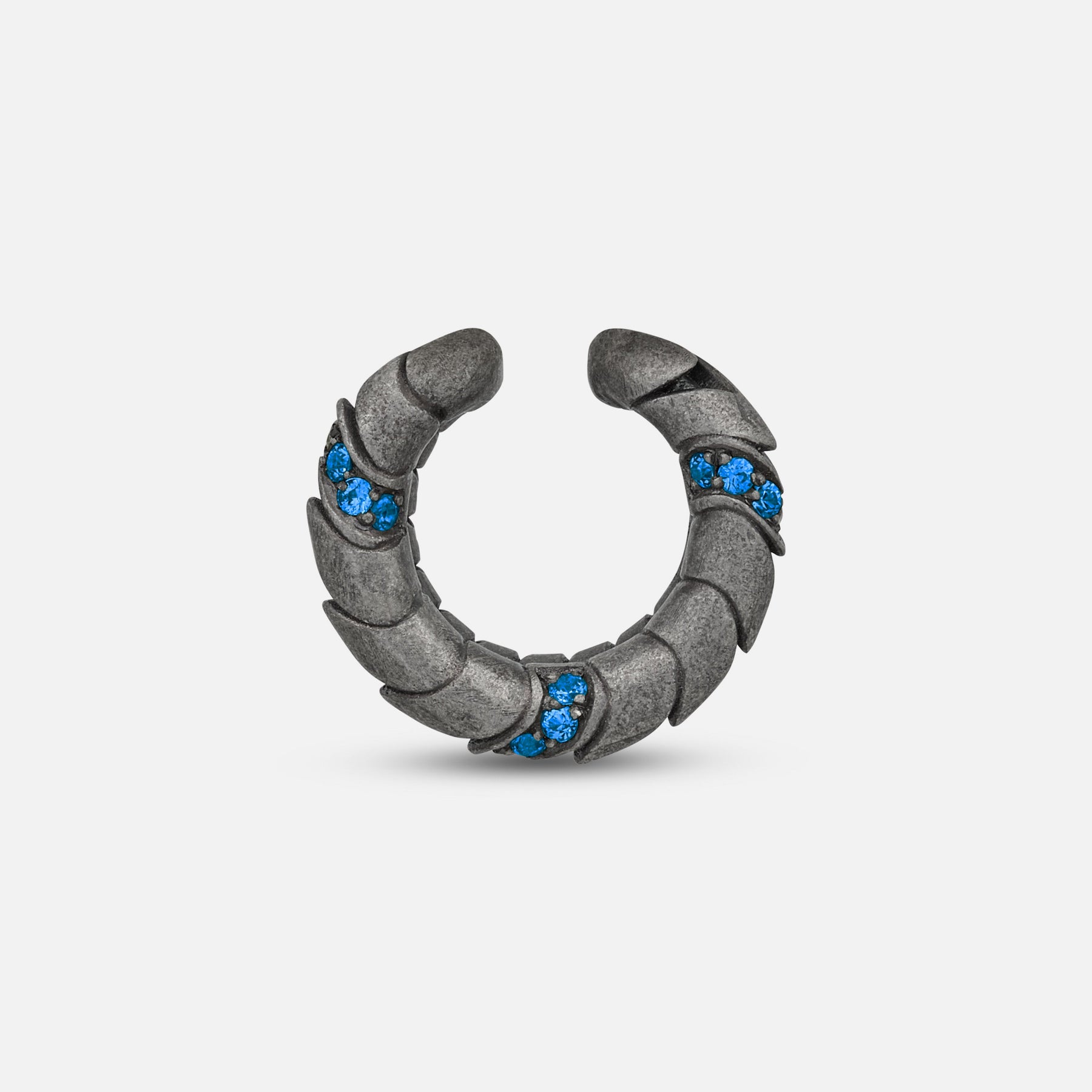Side view of oxidized silver Iron Snake ear cuff showing Pave sapphire detail.