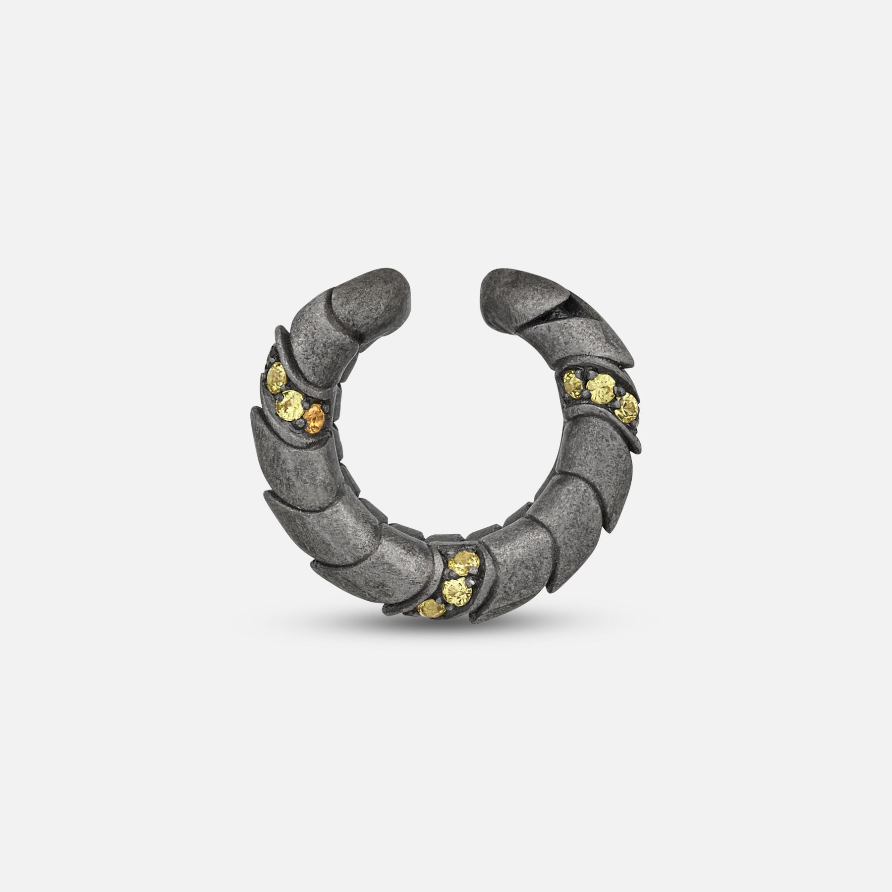 Side view of oxidized silver Iron Snake ear cuff showing Pave yellow sapphire detail.