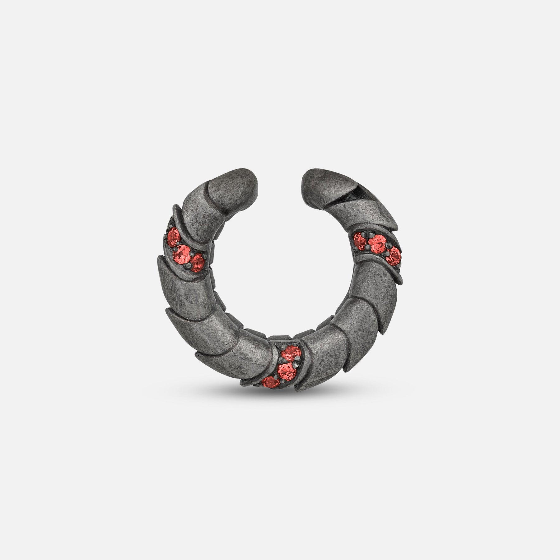 Side view of oxidized silver Iron Snake ear cuff showing Pave red sapphire detail.