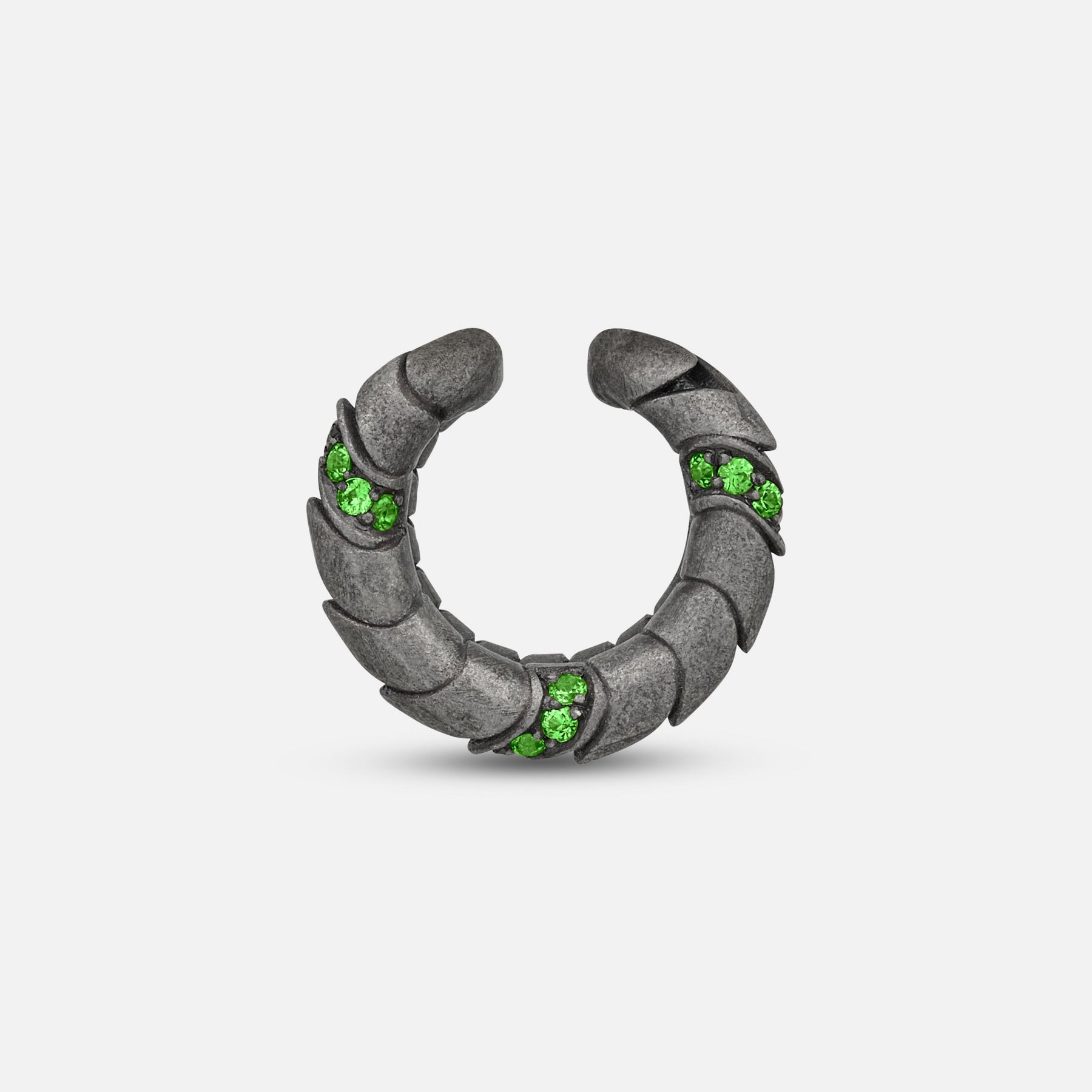 Side view of oxidized silver Iron Snake ear cuff showing Pave tsavorite detail.