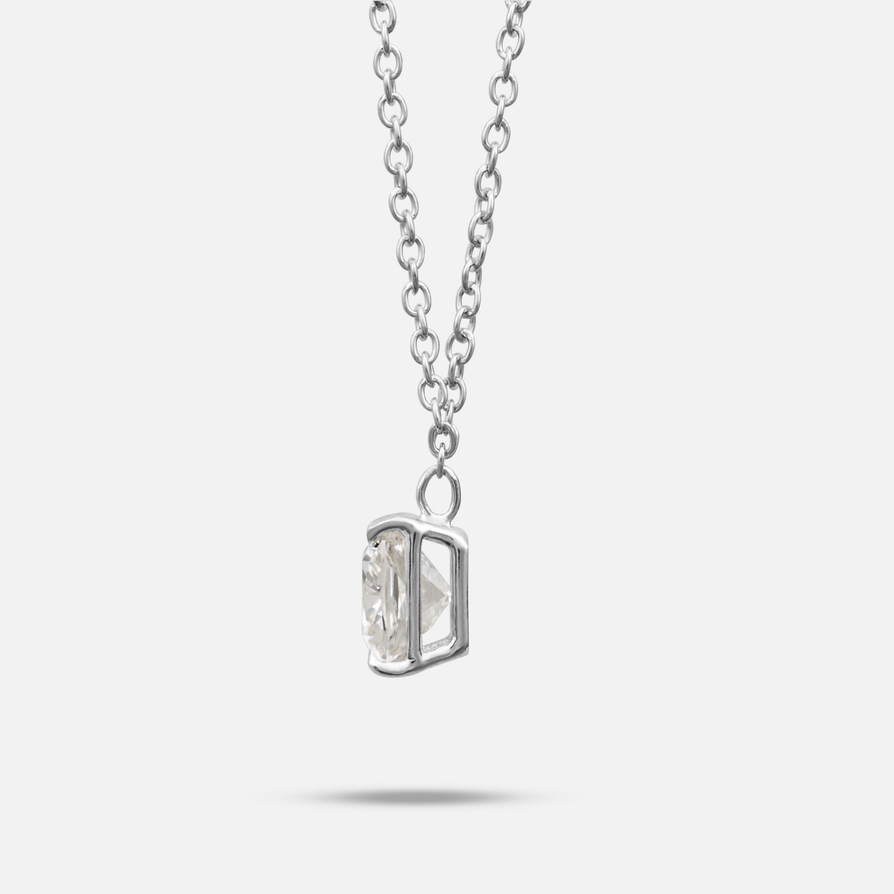 White lab grown diamond and platinum setting shown at a slight angle on Eclipse Celeste Pendant
