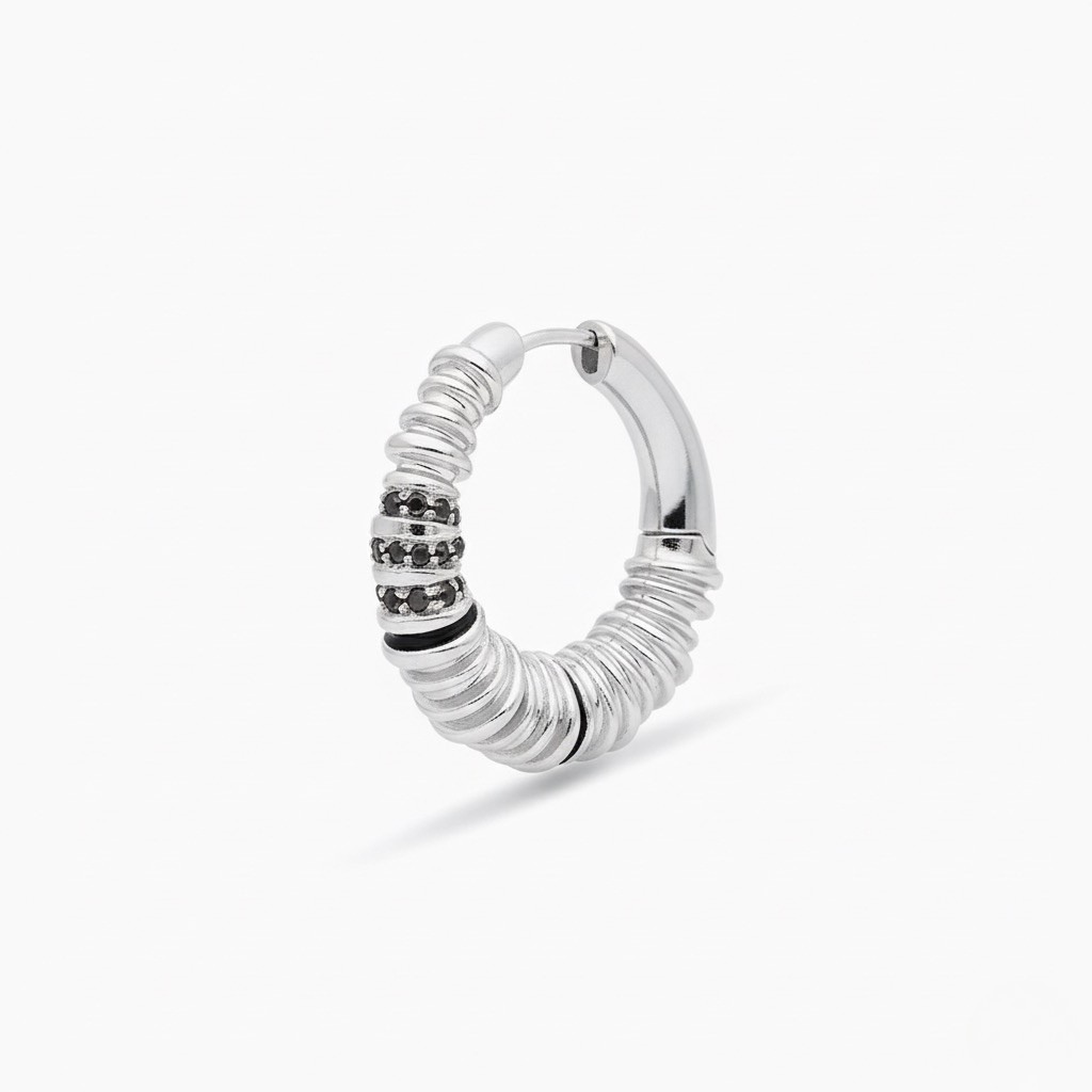Silver hoop earring with black accents on a white background