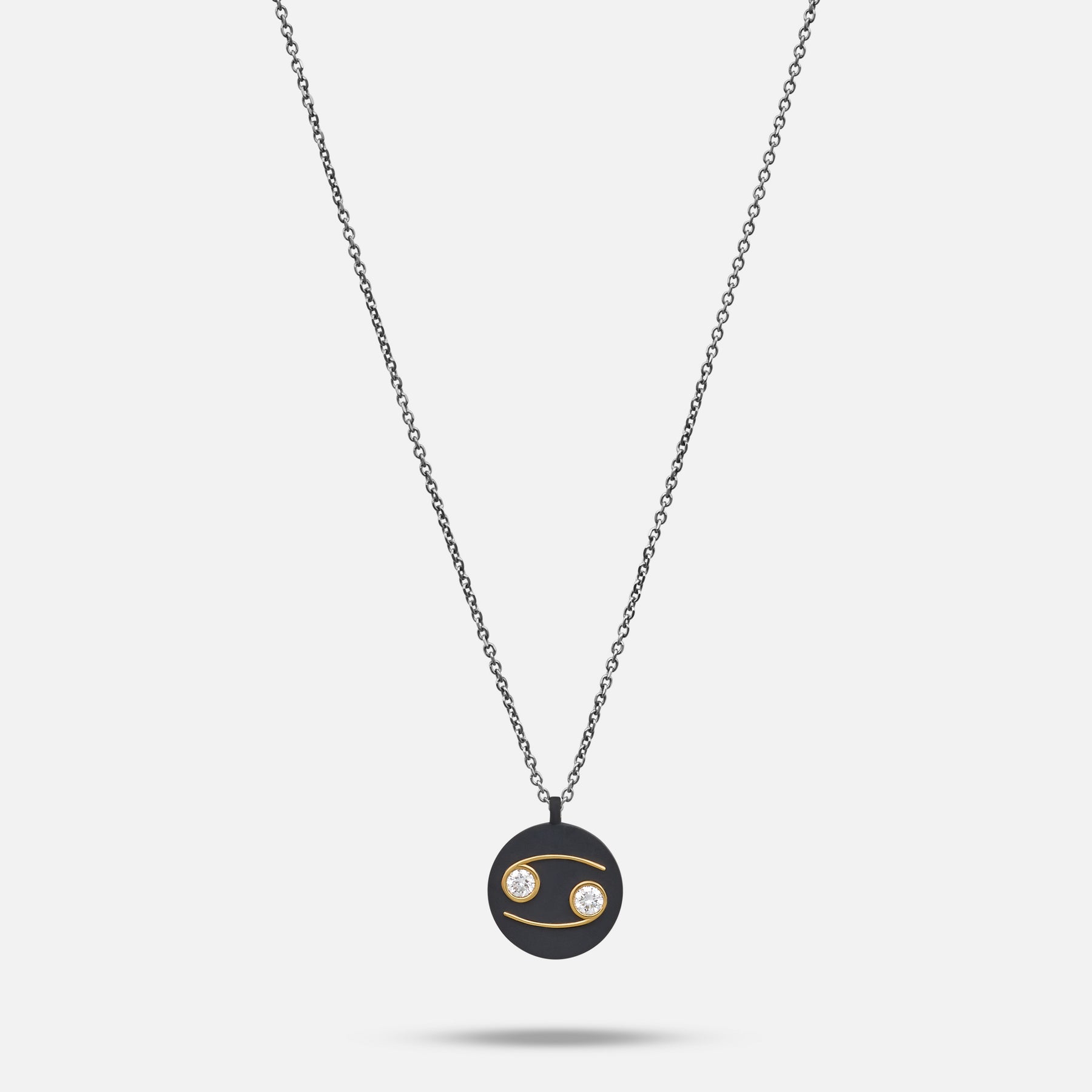 Eclipse Cancer Pendant in black titanium