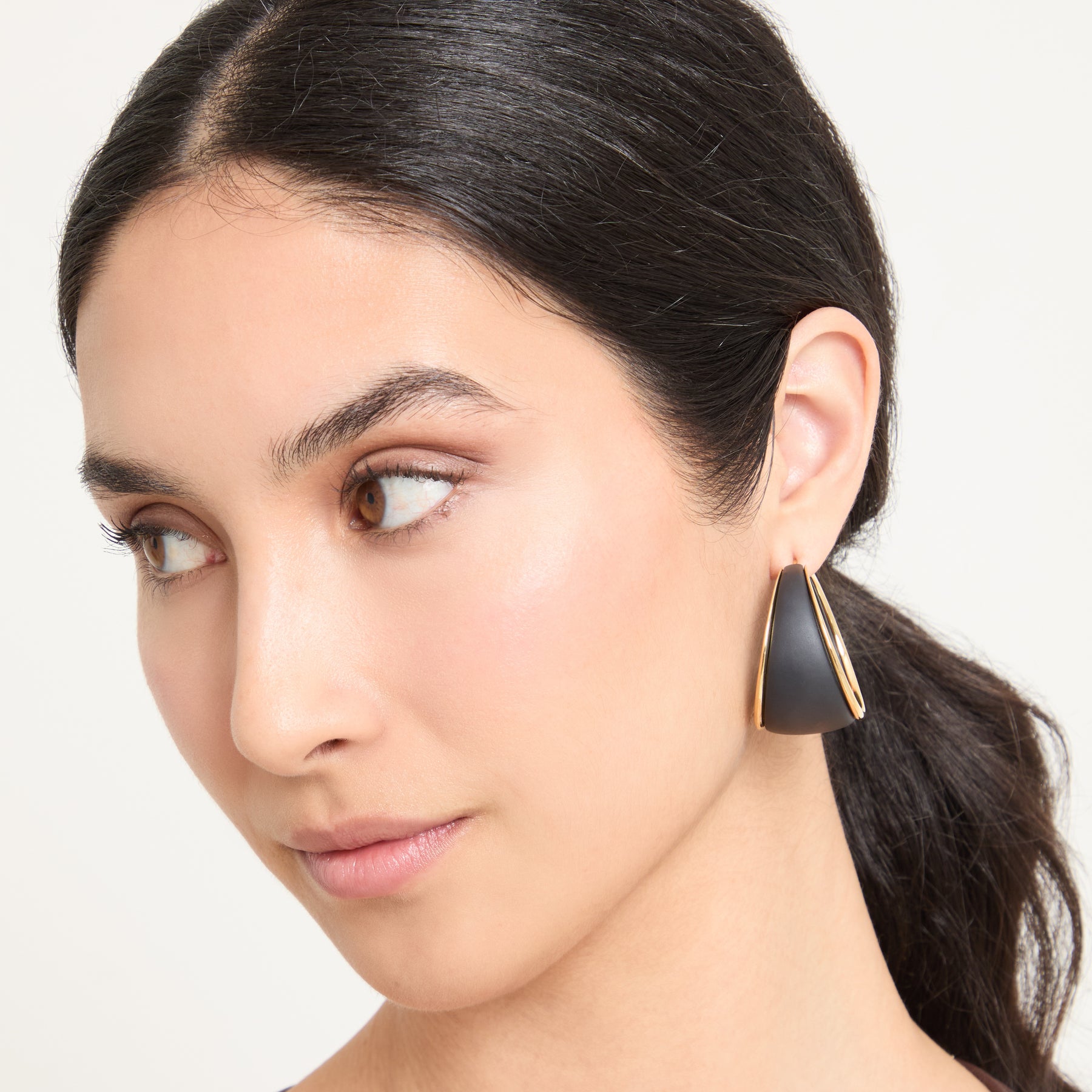 Eclipse Wide Dawn Hoops worn alone by model against neutral background