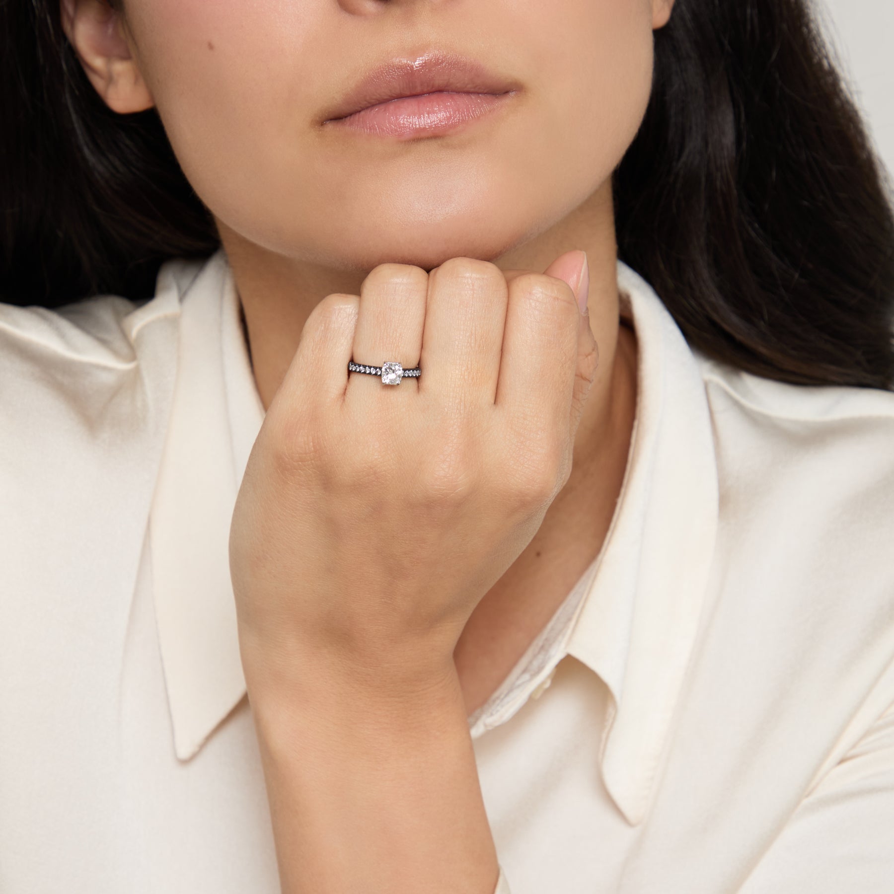 Eclipse Celeste Ring worn alone by model against neutral background