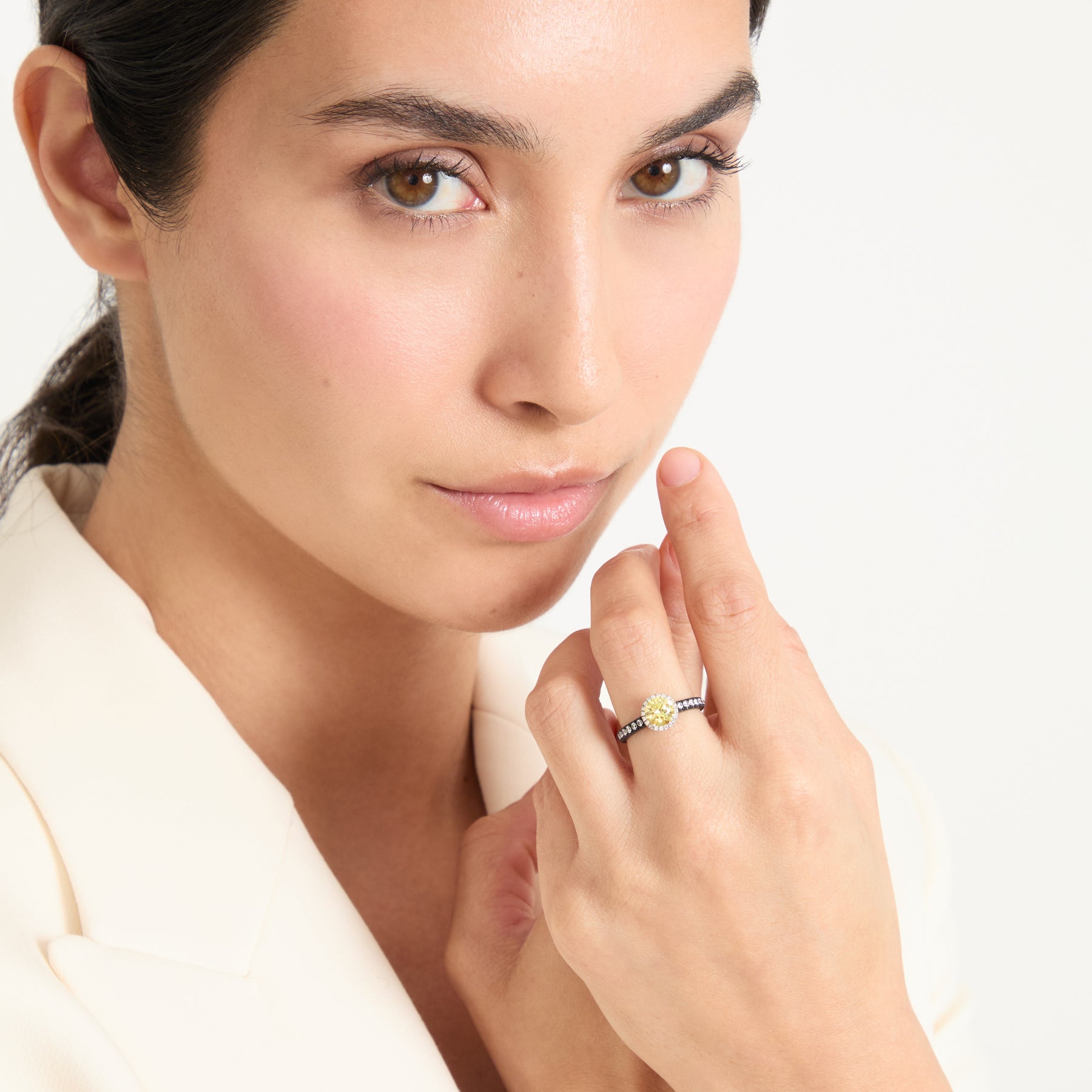Model wearing Eclipse Luna Halo Ring shown in styled position
