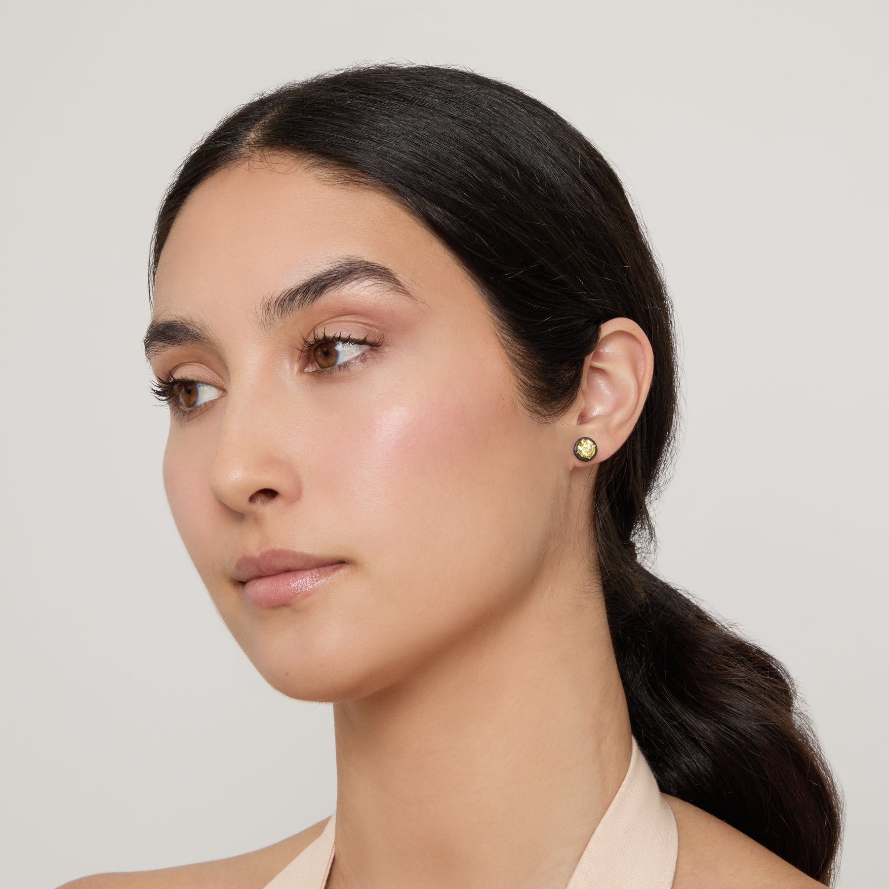 Model wearing Eclipse Black Luna Earrings shown in styled position