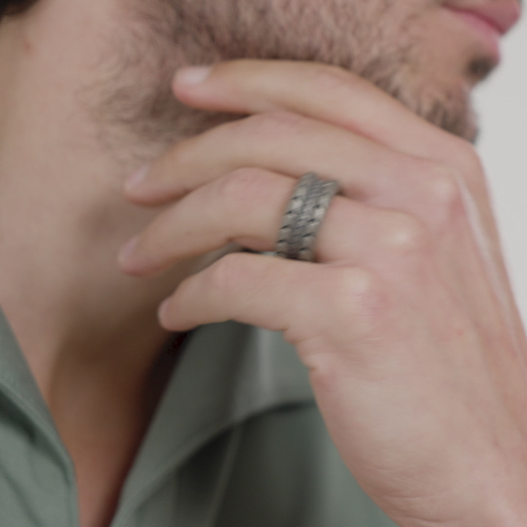 Video of a model wearing the Iron Snake oxidized silver ring on ring finger.