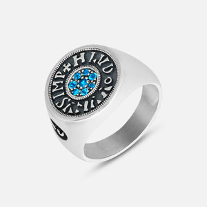 Silver ring with blue gemstones on a white background