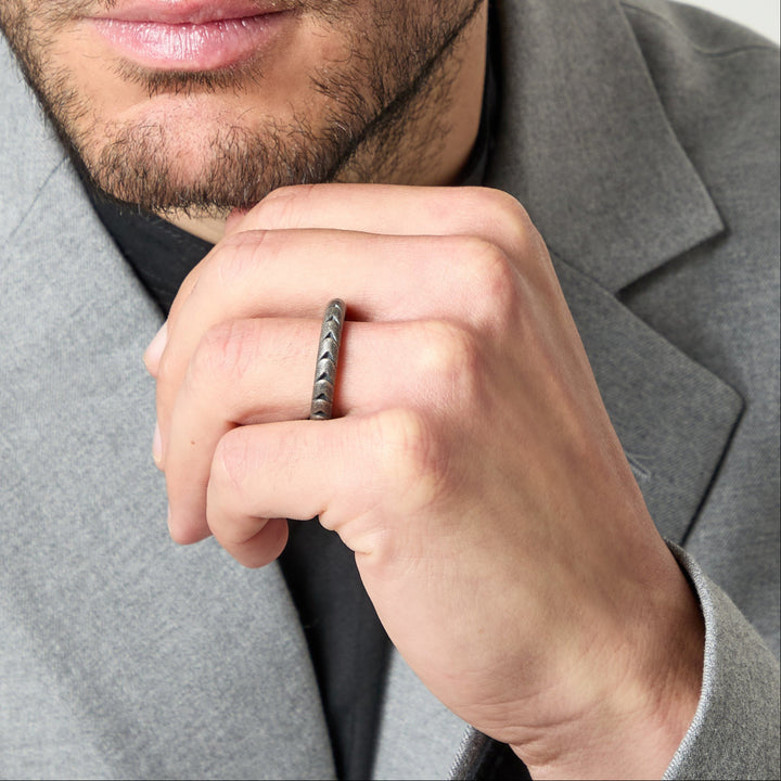 Model wearing Iron Snake Slender Ring in oxidized silver.
