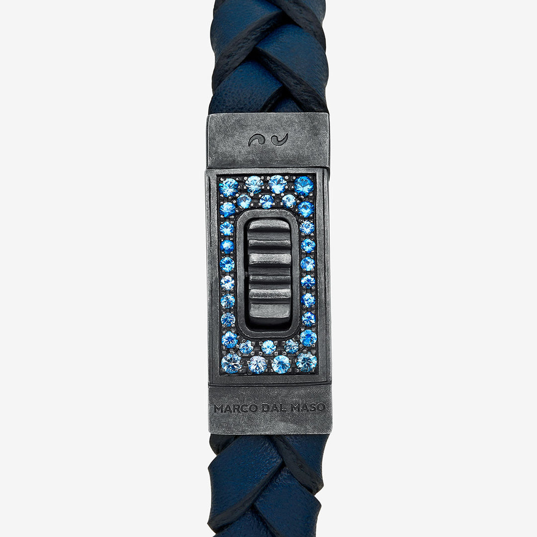 Close-up of Gladiator oxidized silver bracelet with vibrant blue sapphires and leather accents - Marco Dal Maso