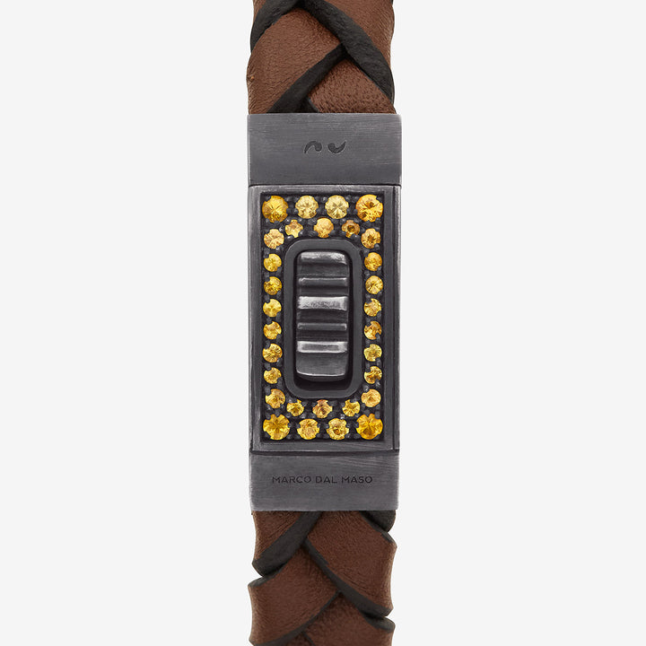 Close-up of Gladiator oxidized silver bracelet with vibrant yellow sapphires and rich brown leather - Marco Dal Maso