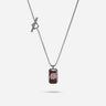 Necklace with a brown pendant and silver chain on a white background