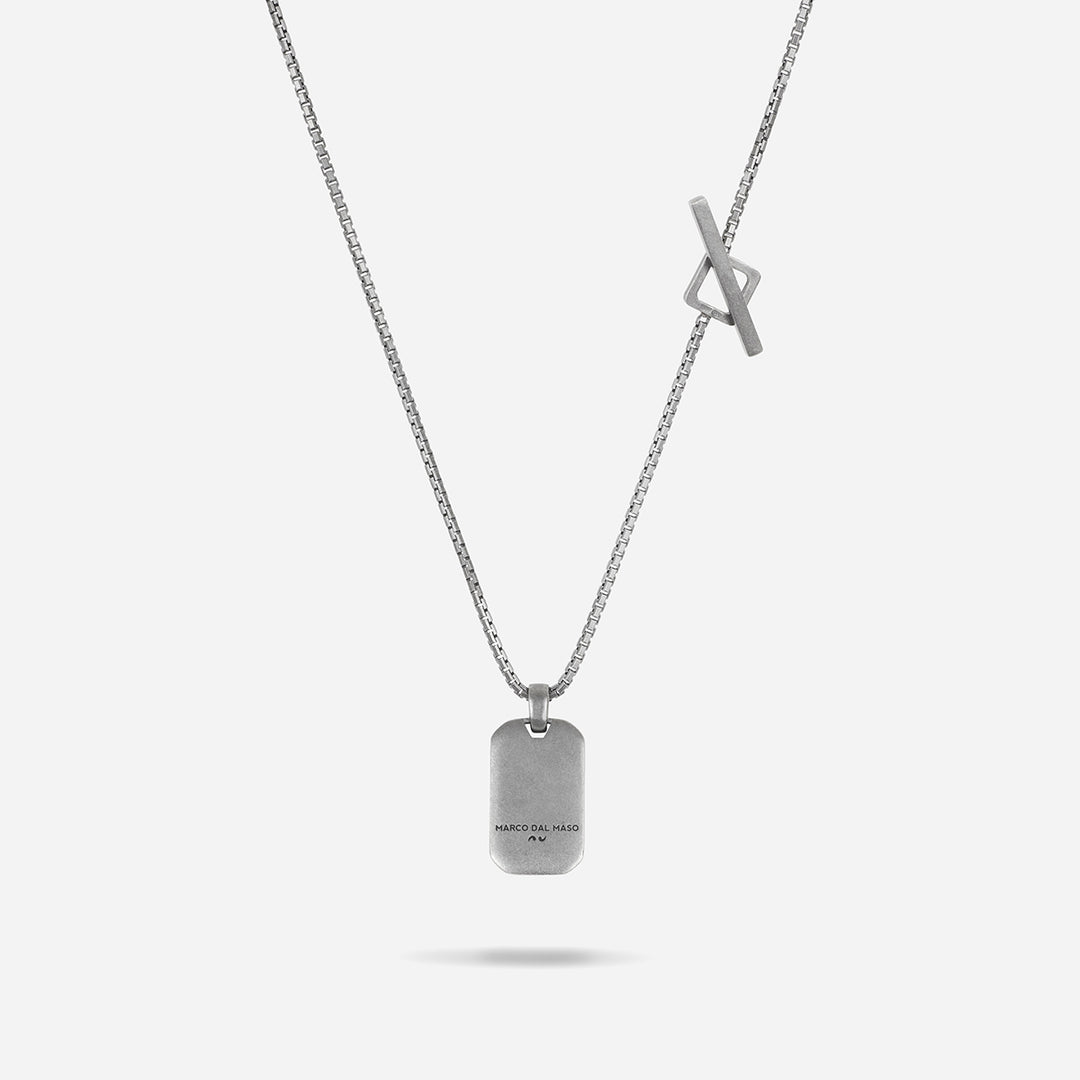 Silver necklace with a tag pendant on a white background