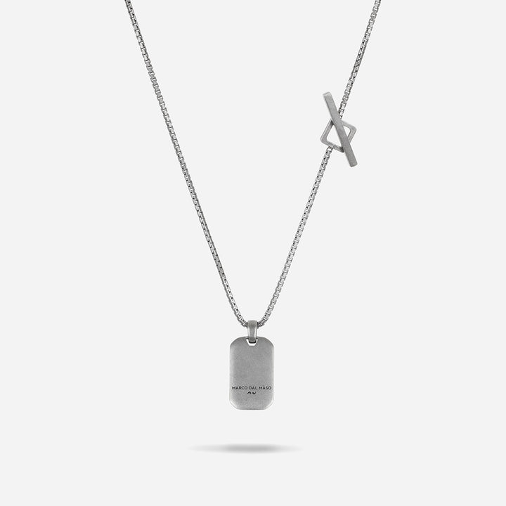 Silver necklace with a tag pendant on a white background