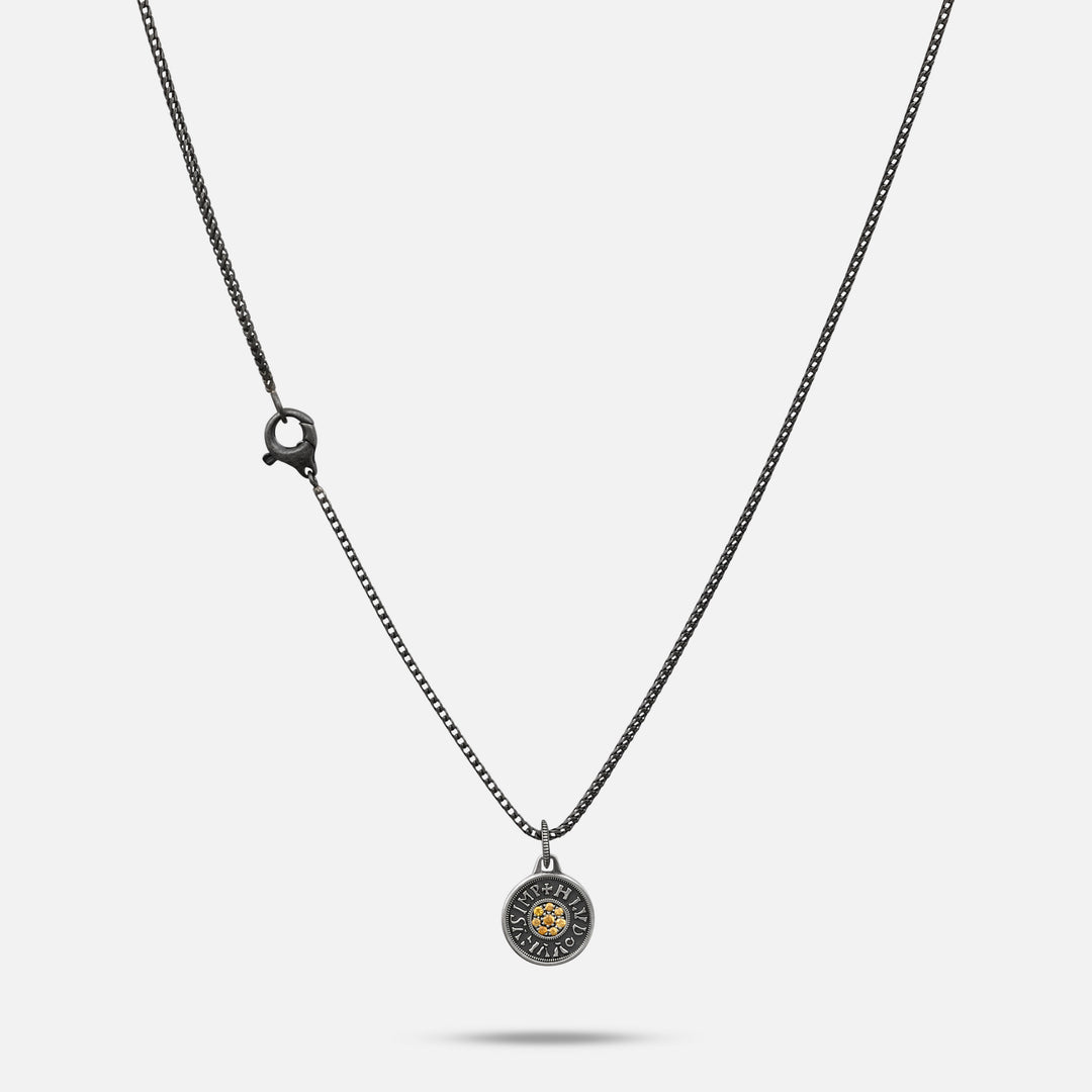 Necklace with a round pendant on a white background
