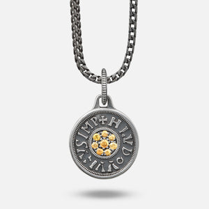 Silver pendant necklace with a chain on a white background