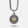 Silver pendant necklace with a chain on a white background