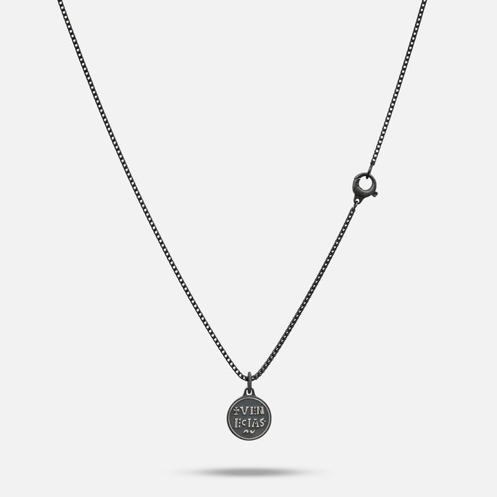 Necklace with a round pendant on a light gray background