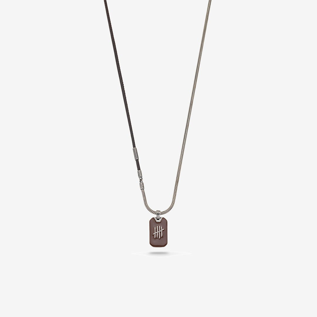 Necklace with a dog tag pendant on a light gray background