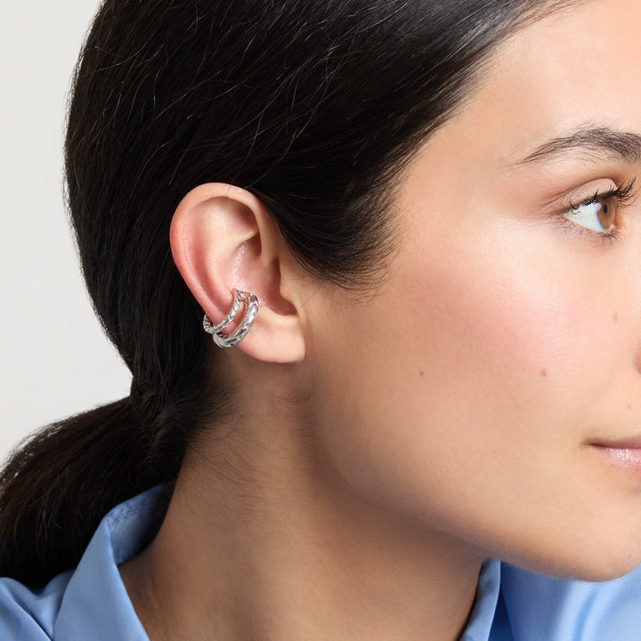 Model wearing the polished silver Iron Snake ear cuff.