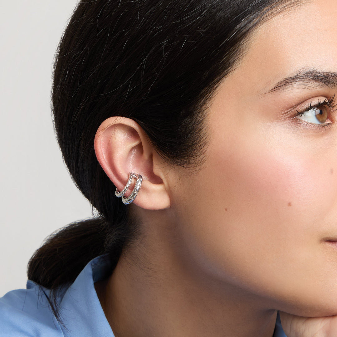 Model wearing the polished silver Iron Snake ear cuff.