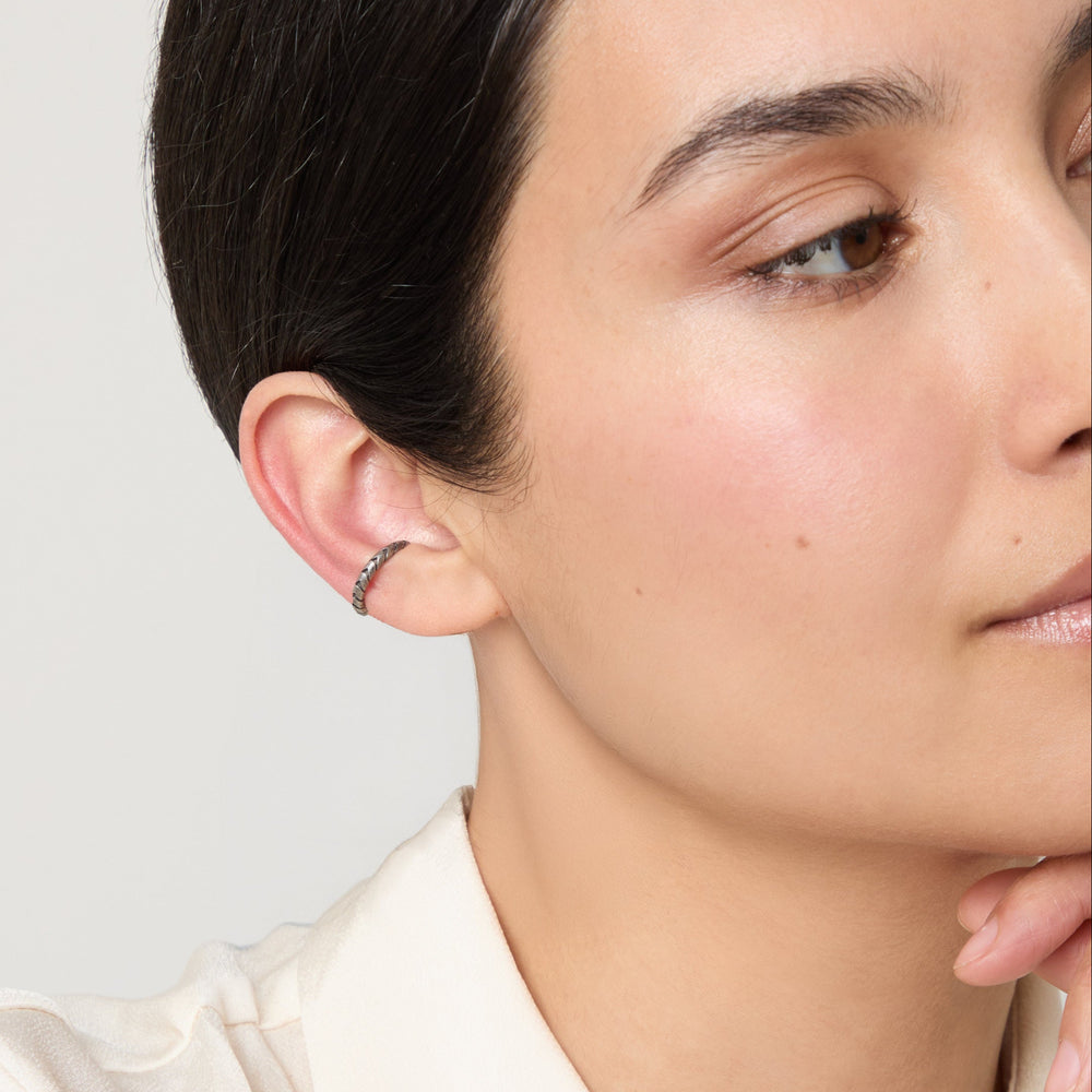 Model wearing Iron Snake Slender Ear Cuff in oxidized silver.