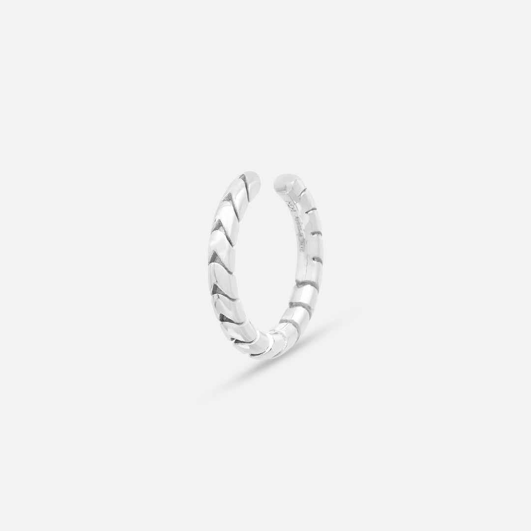 Close-up of Iron Snake Slender Ear Cuff in polished silver.