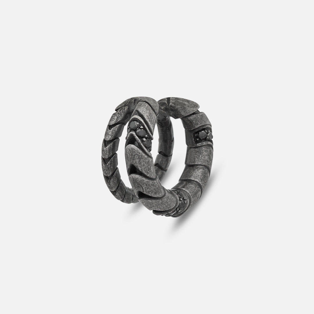 Close-up of Iron Snake Pavé Ear Cuff in oxidized silver with black diamonds.