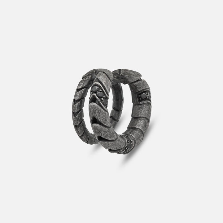 Close-up of Iron Snake Pave Ear Cuff in oxidized silver with black diamonds.
