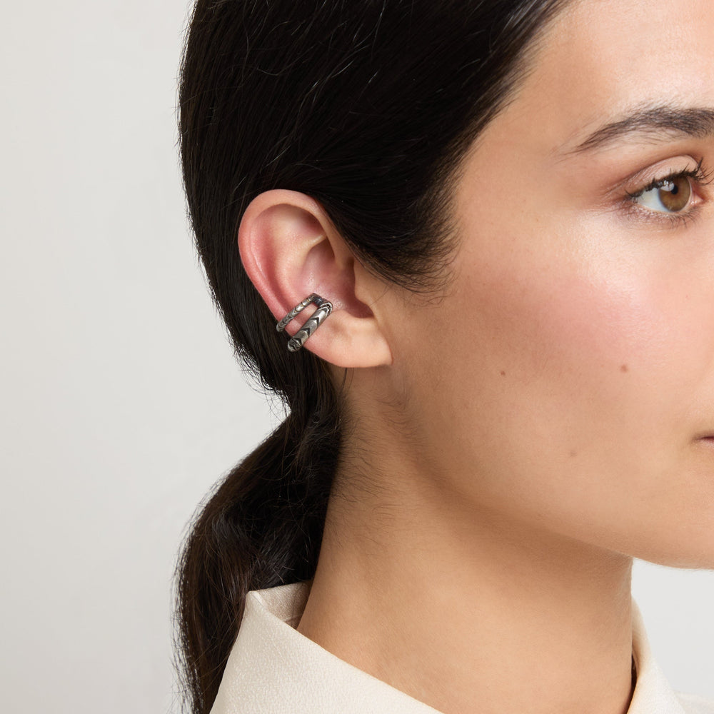 Model wearing Iron Snake Pavé Ear Cuff in oxidized silver.