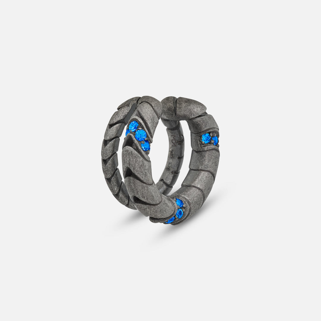 Close-up of Iron Snake Pavé Ear Cuff in oxidized silver with blue sapphires.