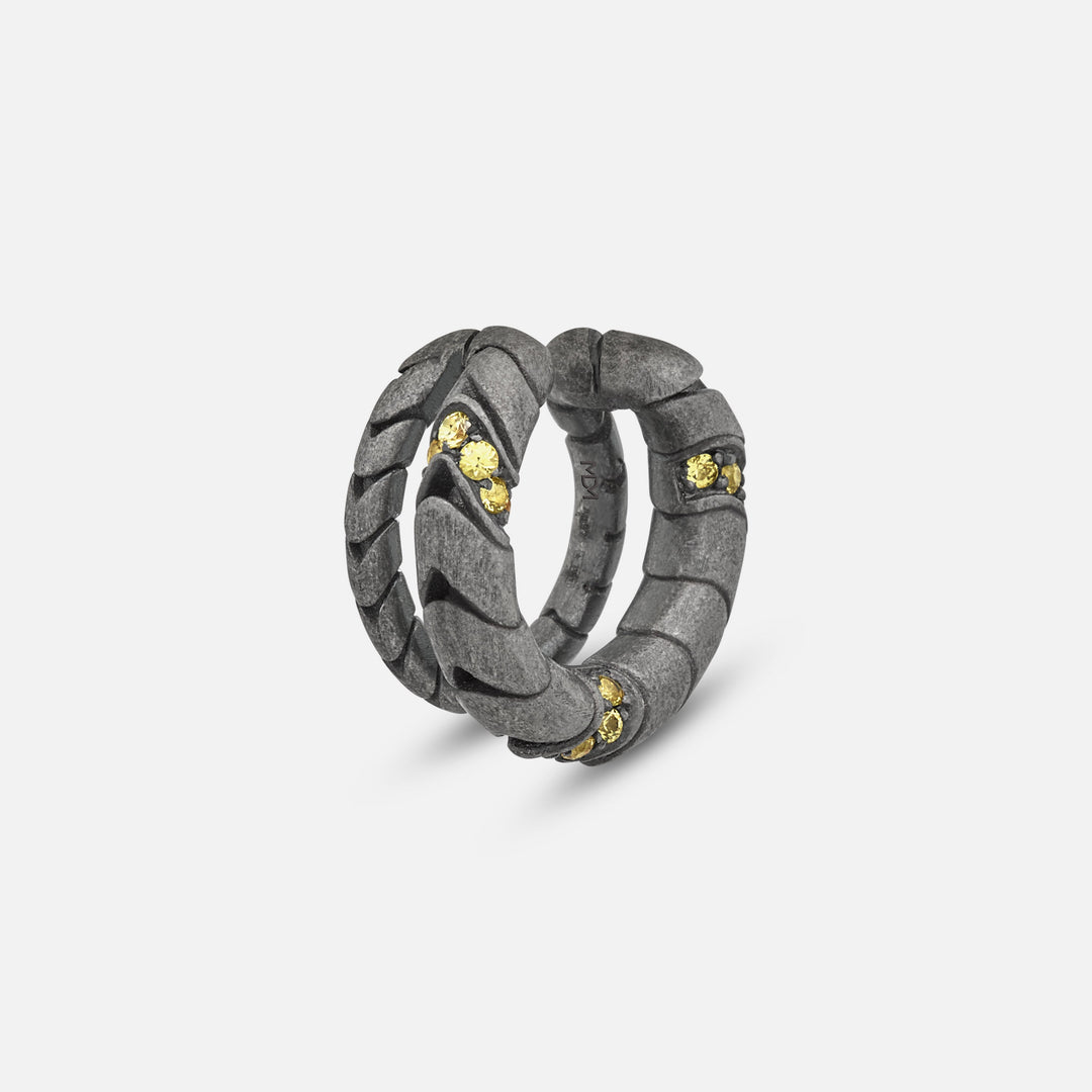 Close-up of Iron Snake Pavé Ear Cuff in oxidized silver with yellow sapphires.