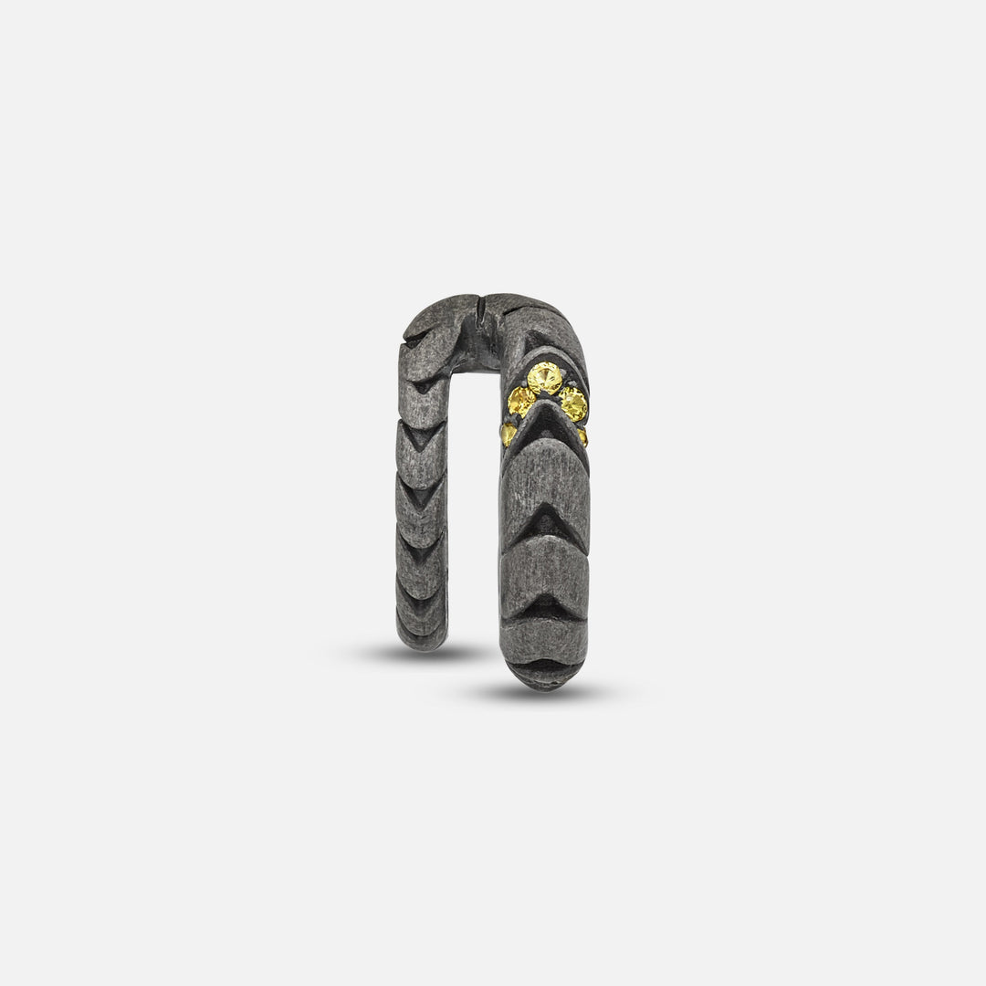 Front view of oxidized silver Iron Snake ear cuff showing Pave yellow sapphire detail.