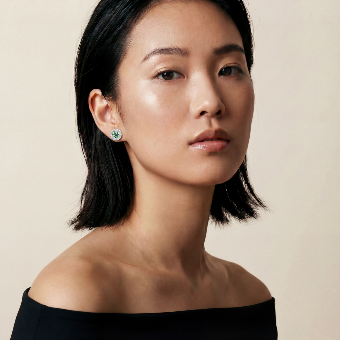 Woman wearing a black off-shoulder top against a beige background