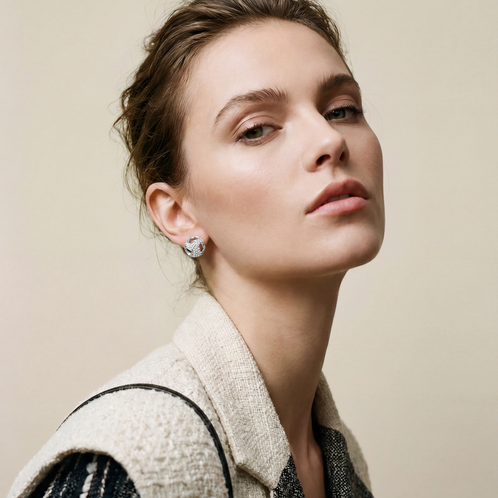 Woman wearing a textured sweater with a neutral background