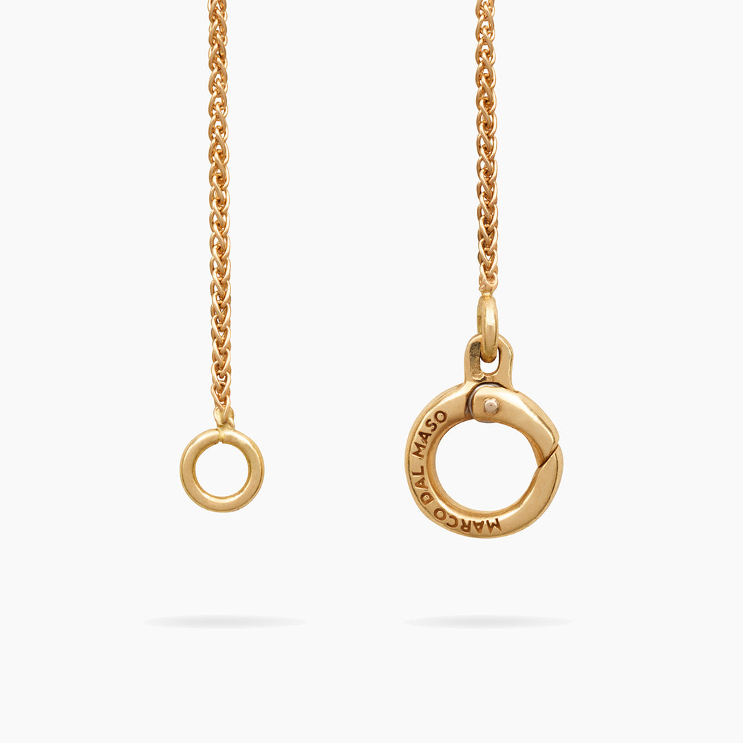 Close-up of Amaia Twilight Diamond Pendant showing brushed gold and gemstone contrast.