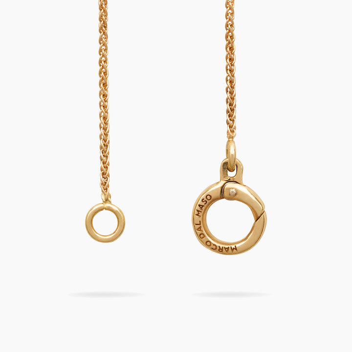 Close-up of Amaia Twilight Diamond Pendant showing brushed gold and gemstone contrast.