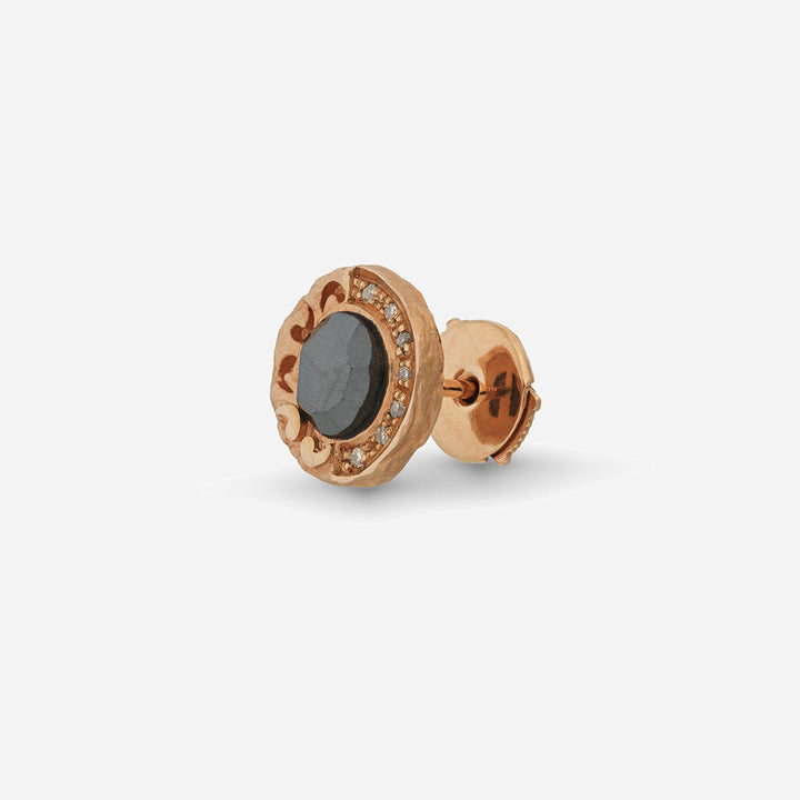 Side angle view of Warrior stud earring showing rose gold setting with hematite and champagne diamonds