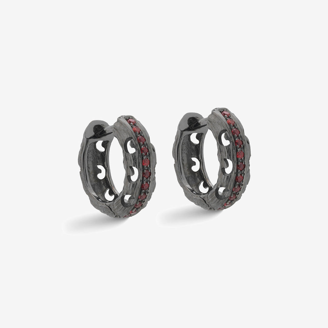 Marco Dal Maso Men carved hoop earrings featuring intricate warrior design in silver, displayed on a neutral background.
