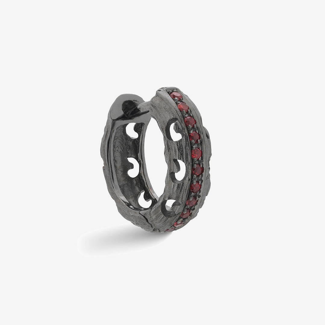 Marco Dal Maso Men carved hoop earrings with bold, detailed design in black metal on a plain background.