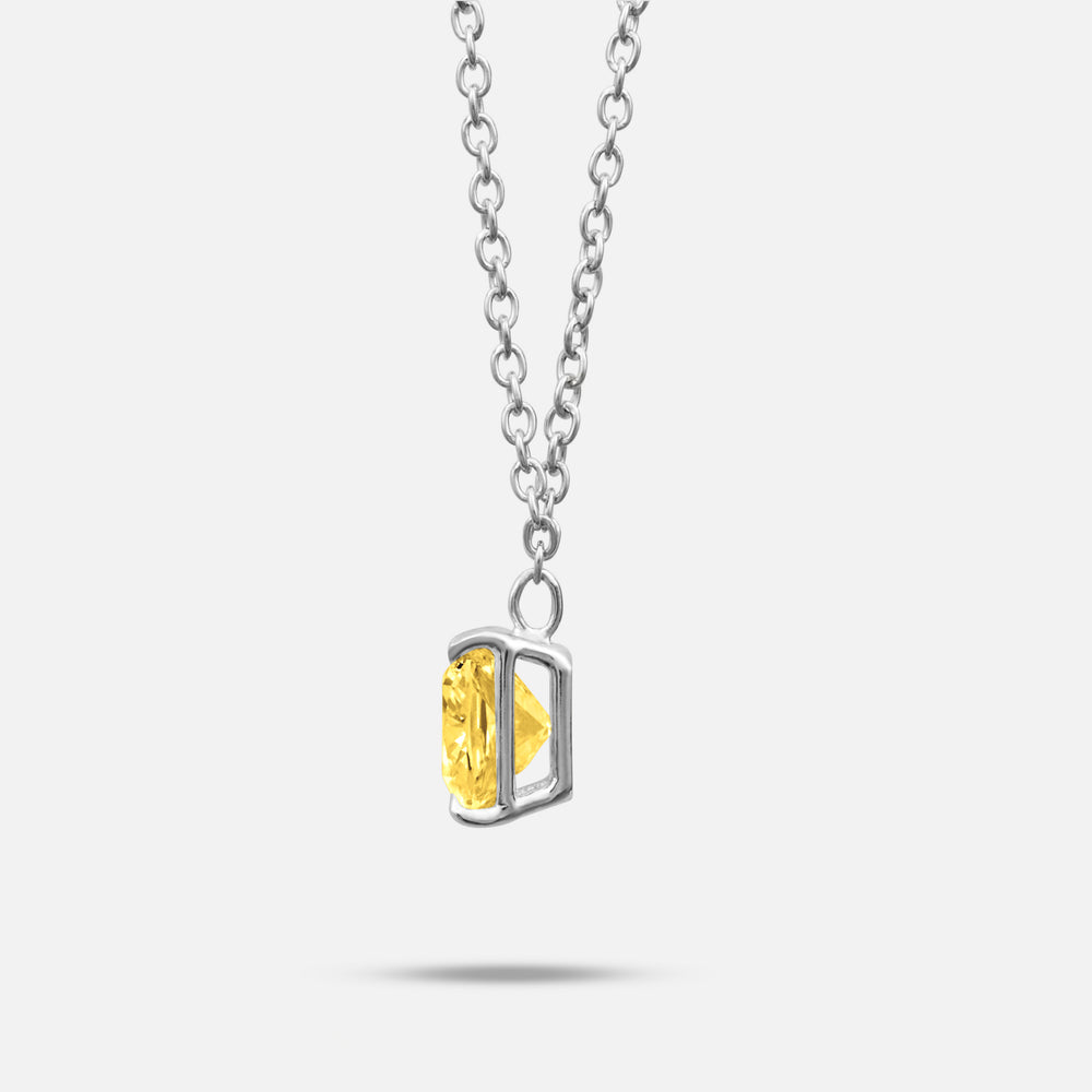 Yellow lab grown diamond and platinum setting shown at a slight angle on Eclipse Celeste Pendant