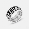 Silver ring with black and white striped design on a white background