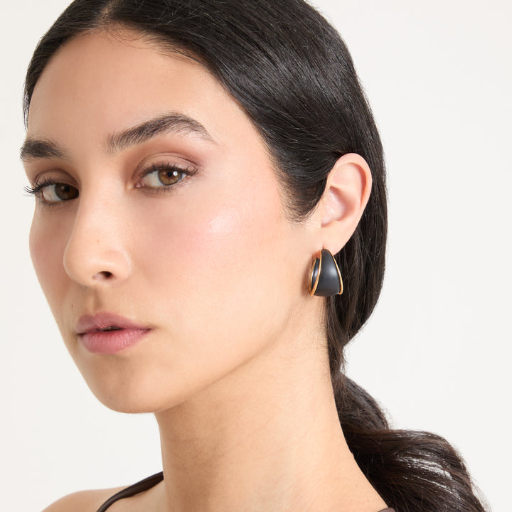 Eclipse Dawn Hoops worn alone by model against neutral background