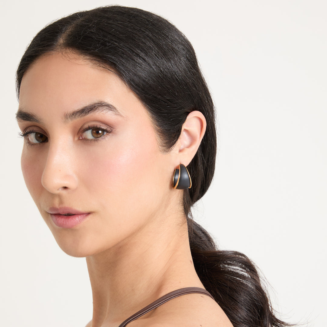 Model wearing Eclipse Dawn Hoops shown in styled position