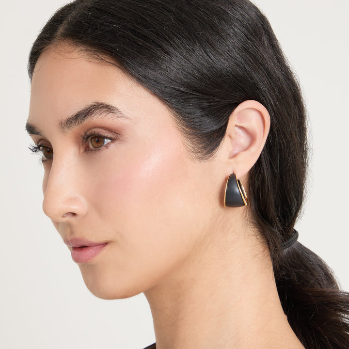 Model wearing Eclipse Dawn Hoops shown in styled position